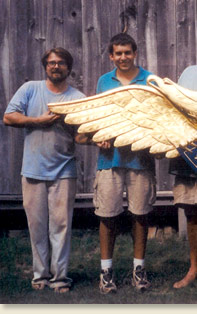 picture of paul white with team of woodcarvers
