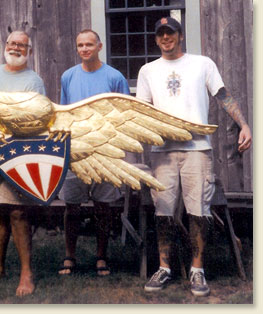 continuation of picture of paul with woodcarving team